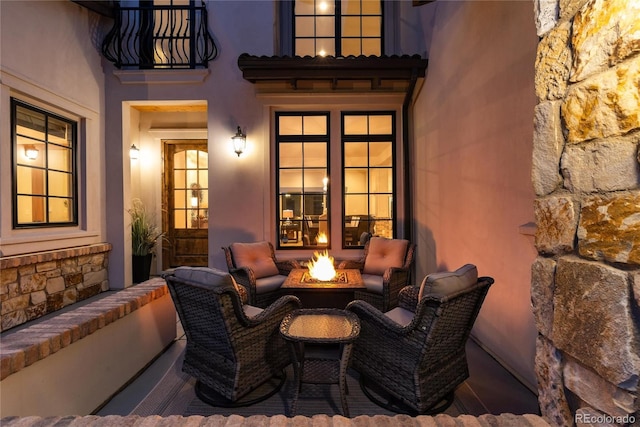 view of patio with a fire pit