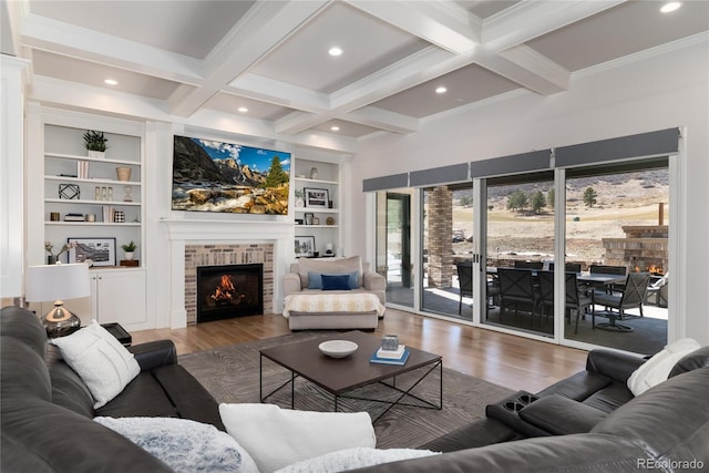 8033 Galileo Way, Littleton, CO 80125 - living room with a fireplace, wood finished floors, beamed ceiling, coffered ceiling, and built in features
