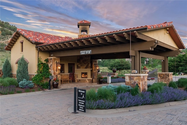 8033 Galileo Way, Littleton, CO 80125 - view of patio / terrace with a lit fireplace