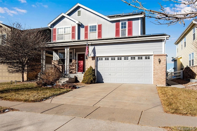 view of front of home with a porch and a garage