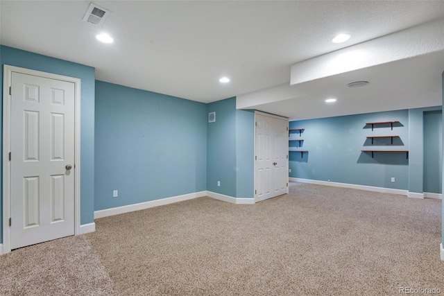 basement with light colored carpet