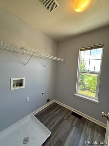 laundry room featuring electric dryer hookup, washer hookup, and hardwood / wood-style floors