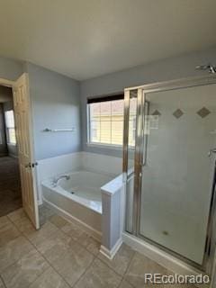 bathroom with shower with separate bathtub and tile patterned flooring