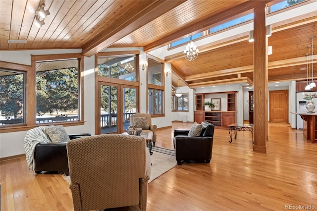 living room featuring vaulted ceiling, an inviting chandelier, wooden ceiling, light wood-type flooring, and french doors