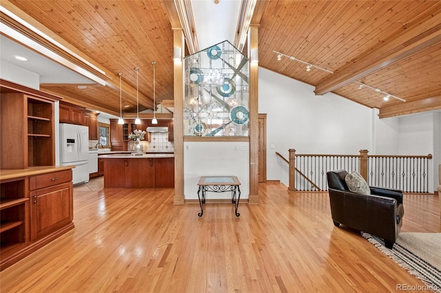 kitchen with pendant lighting, rail lighting, white fridge with ice dispenser, wooden ceiling, and light wood-type flooring