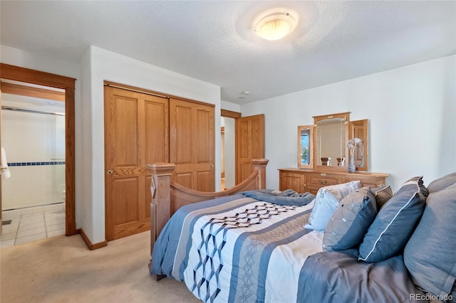 carpeted bedroom featuring a closet and a textured ceiling