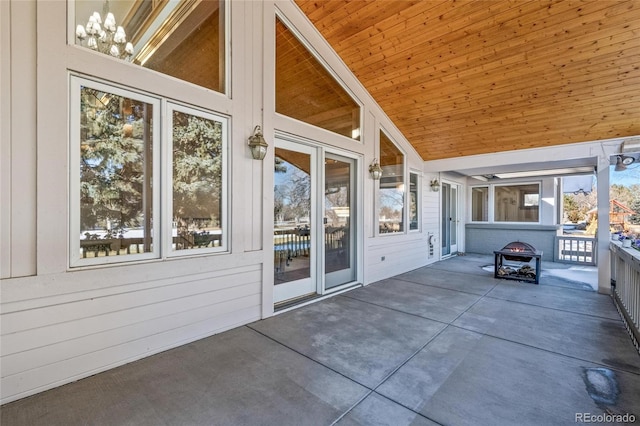 view of patio / terrace featuring an outdoor fire pit