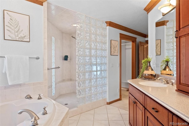 bathroom featuring ornamental molding, vanity, plus walk in shower, and tile patterned flooring