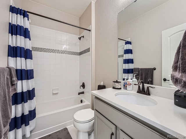 bathroom featuring toilet, vanity, and shower / bath combination with curtain