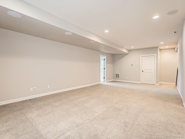 basement featuring recessed lighting, visible vents, light carpet, and baseboards