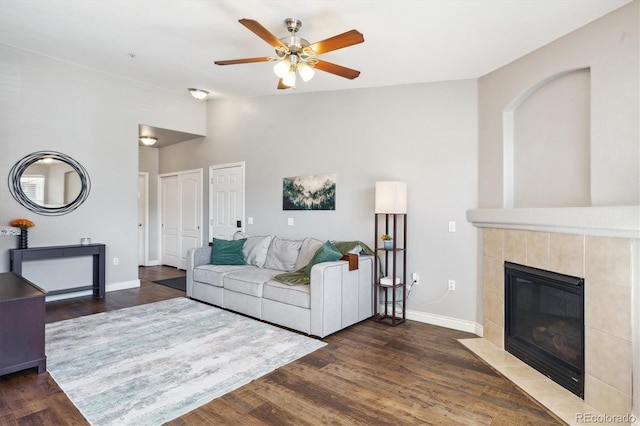 18669 Stroh Rd Unit 10208, Parker, CO 80134 - living area featuring a ceiling fan, baseboards, wood finished floors, and a fireplace