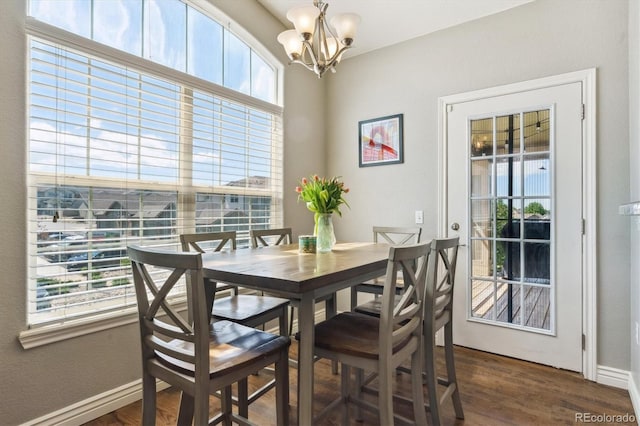 18669 Stroh Rd Unit 10208, Parker, CO 80134 - dining area featuring a chandelier, plenty of natural light, dark wood-style flooring, and baseboards