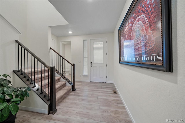 entrance foyer with light hardwood / wood-style floors