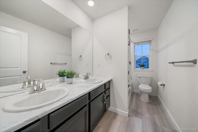 bathroom with vanity and toilet