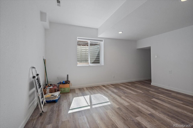 spare room featuring hardwood / wood-style flooring