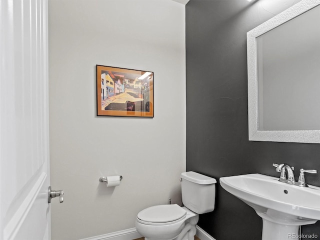 bathroom featuring sink and toilet