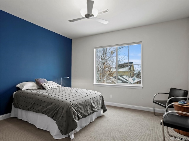 bedroom with light colored carpet and ceiling fan