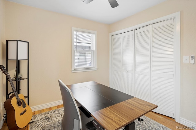 home office featuring ceiling fan and wood-type flooring