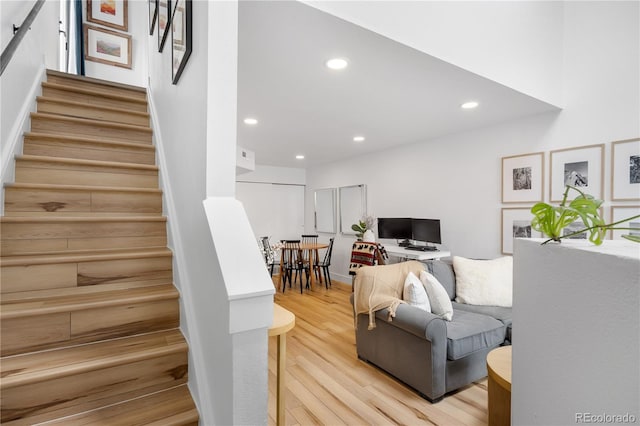 interior space with wood finished floors and recessed lighting