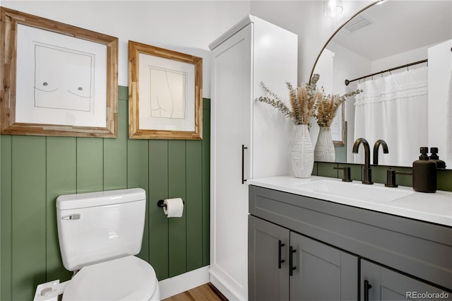 full bathroom featuring vanity, visible vents, and toilet