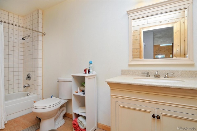 full bathroom featuring vanity, toilet, and shower / tub combo with curtain