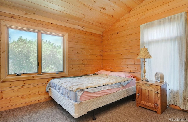 bedroom featuring light carpet, wood walls, wooden ceiling, and vaulted ceiling