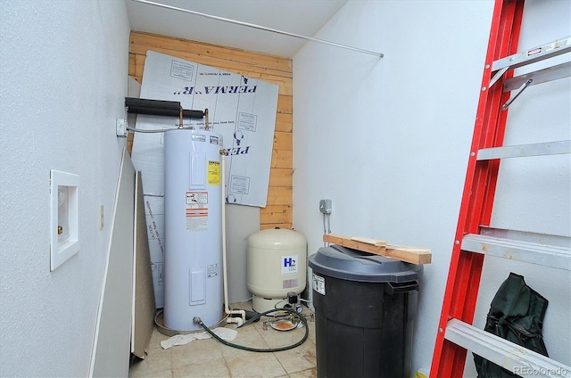 utility room featuring water heater