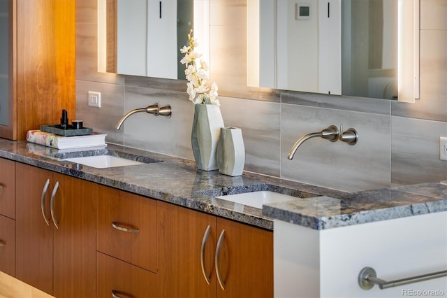 bathroom with vanity and decorative backsplash