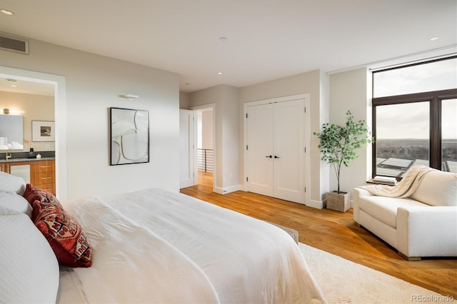 bedroom with light hardwood / wood-style floors