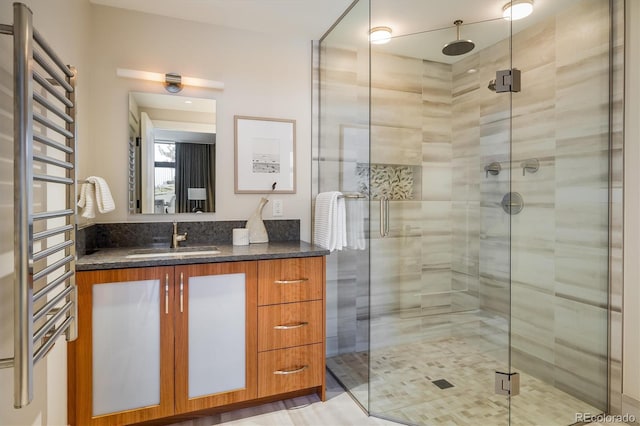 bathroom with vanity and an enclosed shower