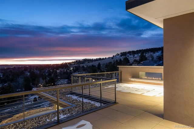 view of balcony at dusk