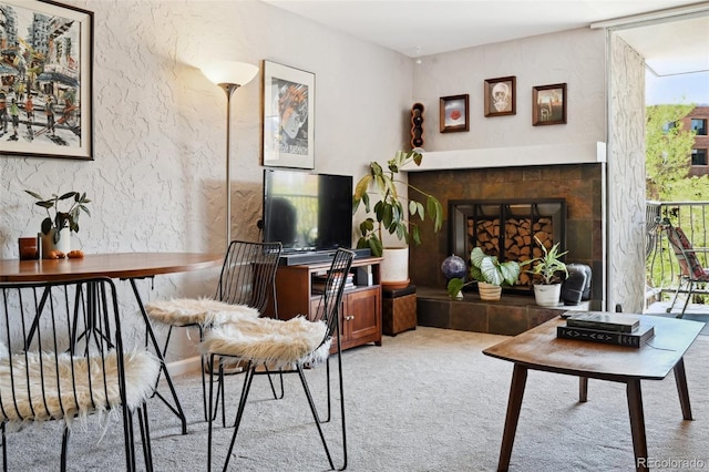 805 29th St Unit 308, Boulder, CO 80303 - carpeted living room with a tiled fireplace and a desk