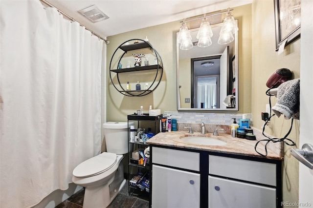 805 29th St Unit 308, Boulder, CO 80303 - bathroom featuring toilet, vanity, tasteful backsplash, and a shower with shower curtain
