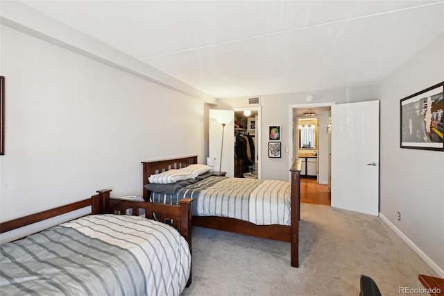 805 29th St Unit 308, Boulder, CO 80303 - carpeted bedroom featuring a spacious closet, a closet, and baseboards