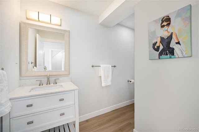 bathroom with vanity and wood-type flooring