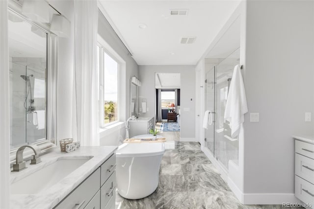 19887 Kershaw Ct, Monument, CO 80132 - full bath with vanity, a shower stall, a freestanding tub, and marble finish floors