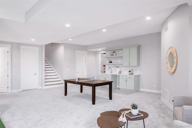 19887 Kershaw Ct, Monument, CO 80132 - living area with light colored carpet, stairs, and recessed lighting