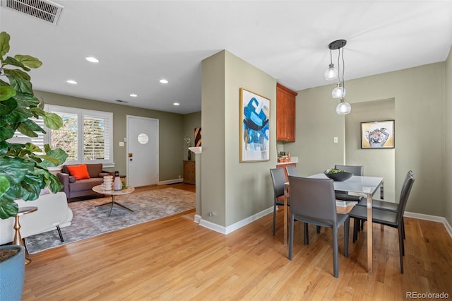 dining area with light hardwood / wood-style flooring