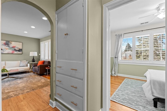 interior space with light hardwood / wood-style floors and multiple windows