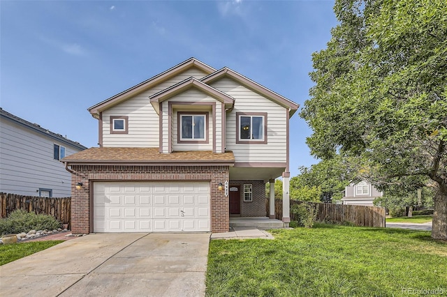 view of property with a garage and a front lawn