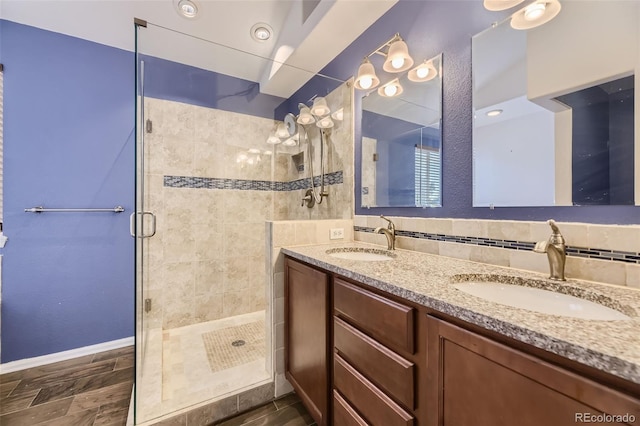 bathroom with vanity and a shower with shower door