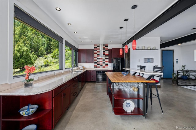 5896 Peregrine Trl, Golden, CO 80403 - kitchen featuring open shelves, concrete floors, dark brown cabinets, and recessed lighting