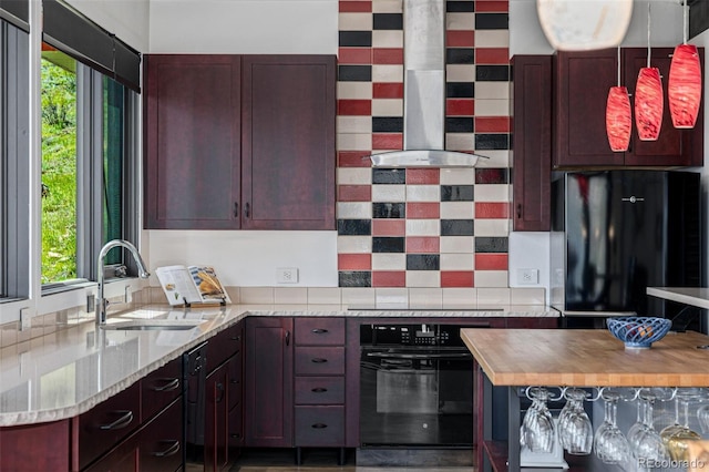 5896 Peregrine Trl, Golden, CO 80403 - kitchen featuring black appliances, a sink, range hood, decorative backsplash, and butcher block countertops
