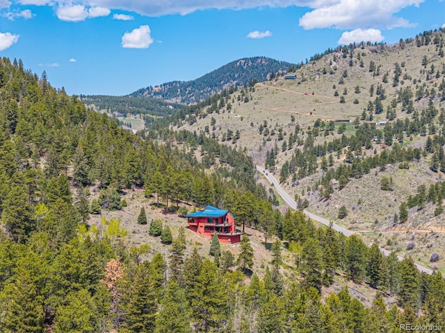 5896 Peregrine Trl, Golden, CO 80403 - mountain view with a heavily wooded area