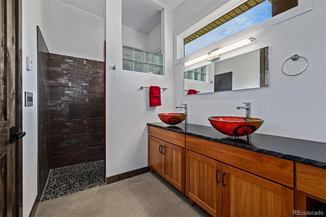5896 Peregrine Trl, Golden, CO 80403 - full bath featuring walk in shower, double vanity, and baseboards
