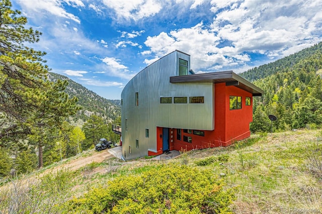 5896 Peregrine Trl, Golden, CO 80403 - exterior space featuring a mountain view and a wooded view