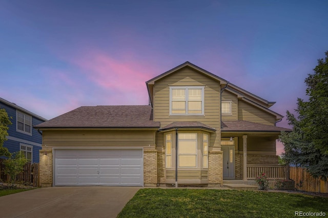 19259 E Caspian Pl, Aurora, CO 80013 - traditional-style house featuring brick siding, driveway, a garage, a porch, and roof with shingles