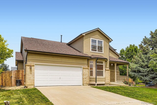 19259 E Caspian Pl, Aurora, CO 80013 - traditional-style house featuring concrete driveway, a garage, brick siding, covered porch, and a shingled roof