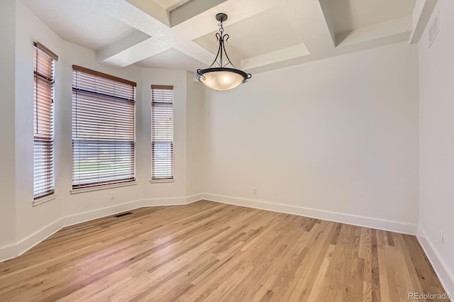 19259 E Caspian Pl, Aurora, CO 80013 - spare room featuring coffered ceiling, light wood finished floors, and beam ceiling