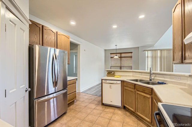 19259 E Caspian Pl, Aurora, CO 80013 - kitchen featuring freestanding refrigerator, dishwasher, light tile patterned flooring, light countertops, and recessed lighting